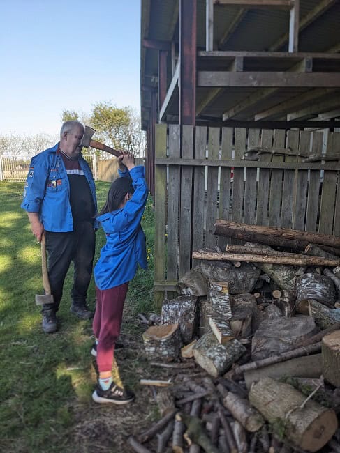 Kid 2.0 learning how to use an axe