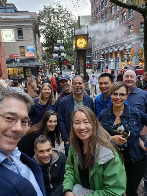 Showing co-workers around Gastown