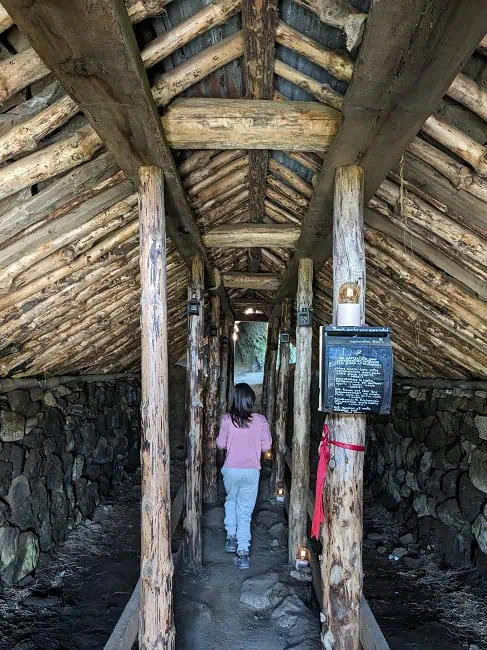 Inside Rutshellir. There are two man-made caves, one runs parallel to this walkway, and the other runs perpendicular.