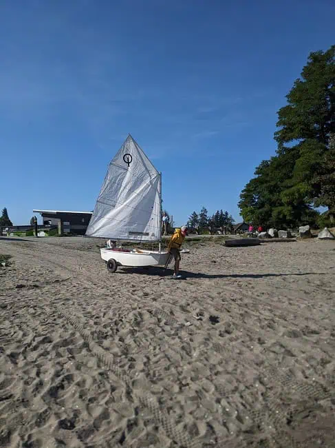 Rolling the sailboat into the water every morning