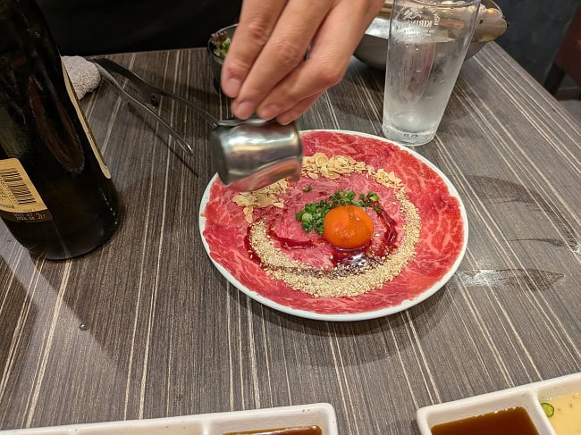 Beef sashimi… You mix the meat with the egg yolk. It was so delicious that we ordered more