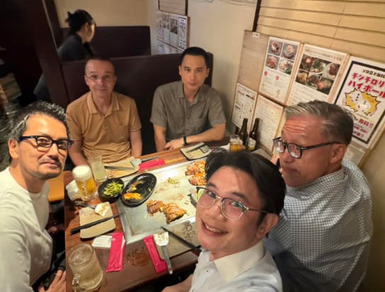 Having okonomiyaki (Japanese teppanyaki savoury pancake) in Osaka